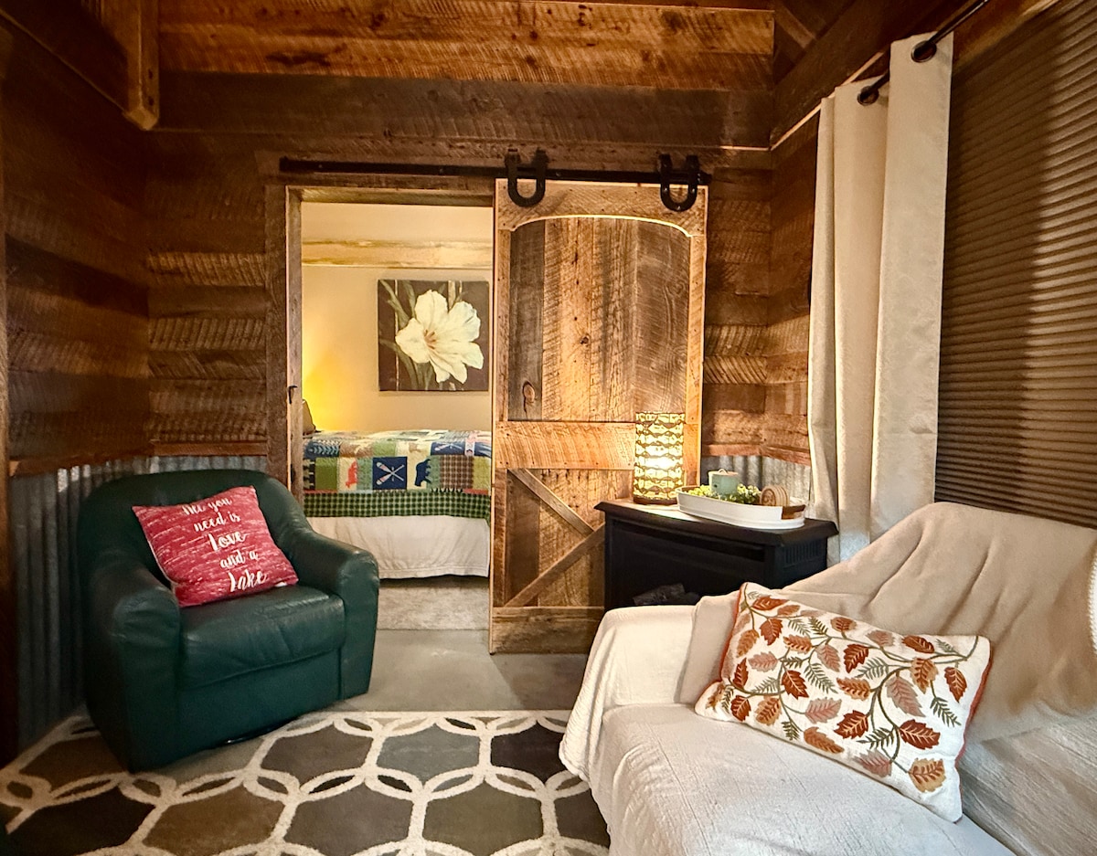 Room 210 living area with reclaimed barn wood and barn door